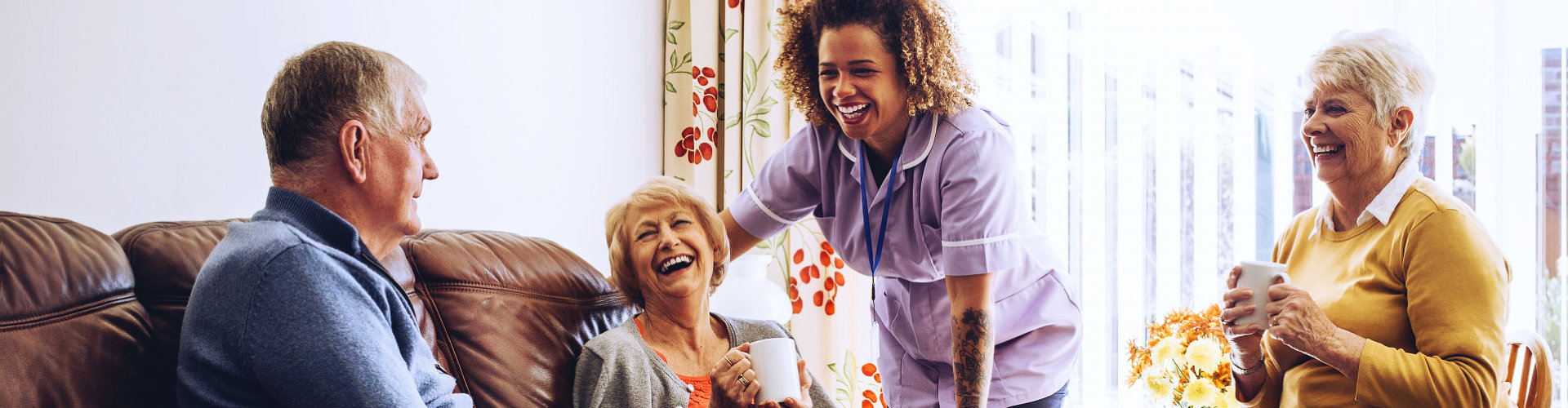 senior people smiling with their caregiver