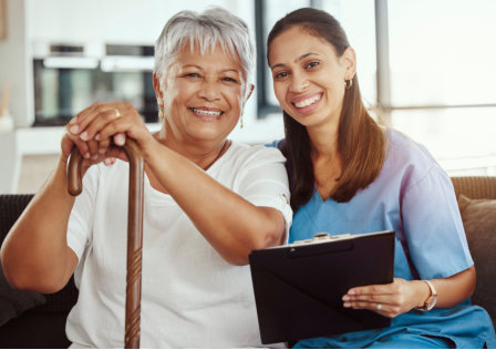 nurse having picture with the senior citizen